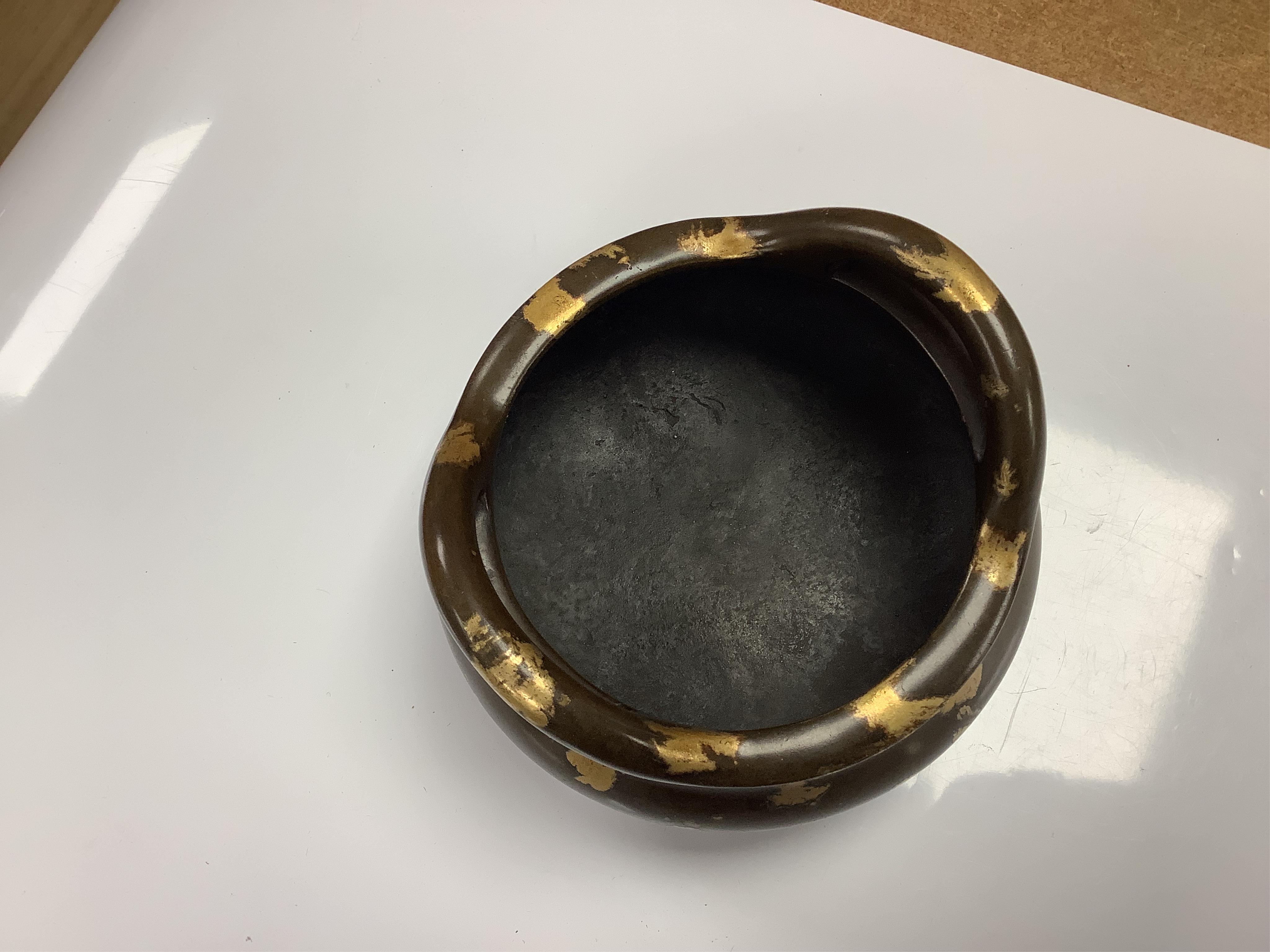 A Chinese gold splash bronze censer, Xuande seal mark to underside, 11cm wide. Condition - good